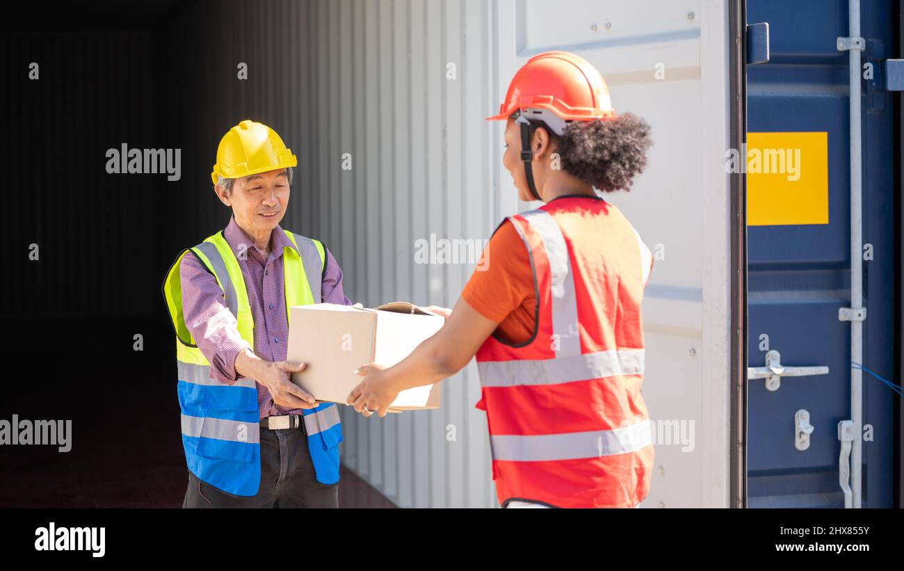 Warehouse cargo business. A Chinese man and a african american woman in