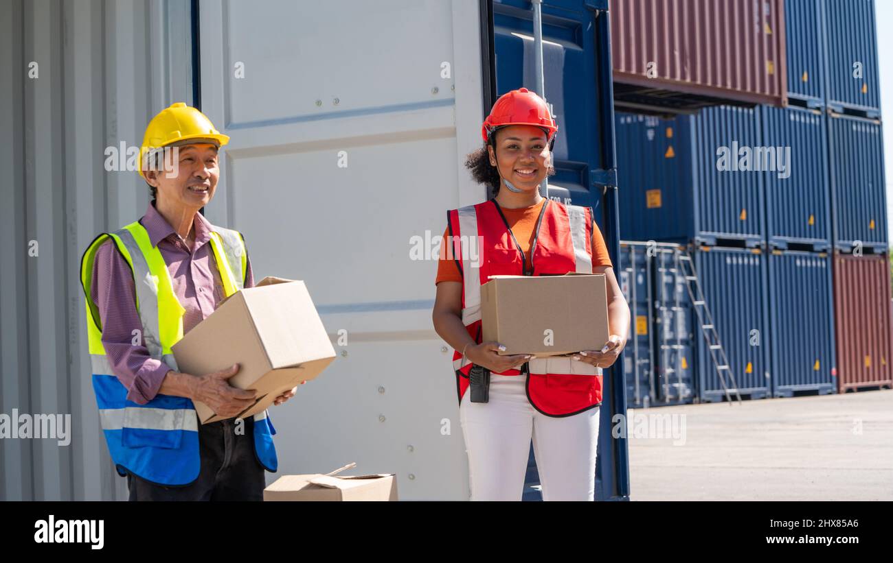 Warehouse cargo business. A Chinese man and a african american woman in