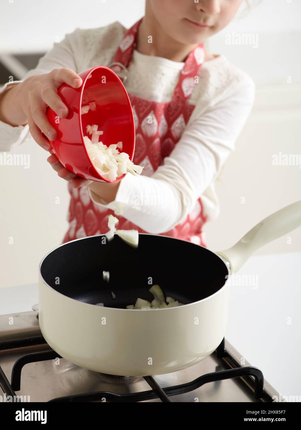 Tomato Soup ÔøΩAdding onion, celery, and carrot to a pot (Step 1 of 4