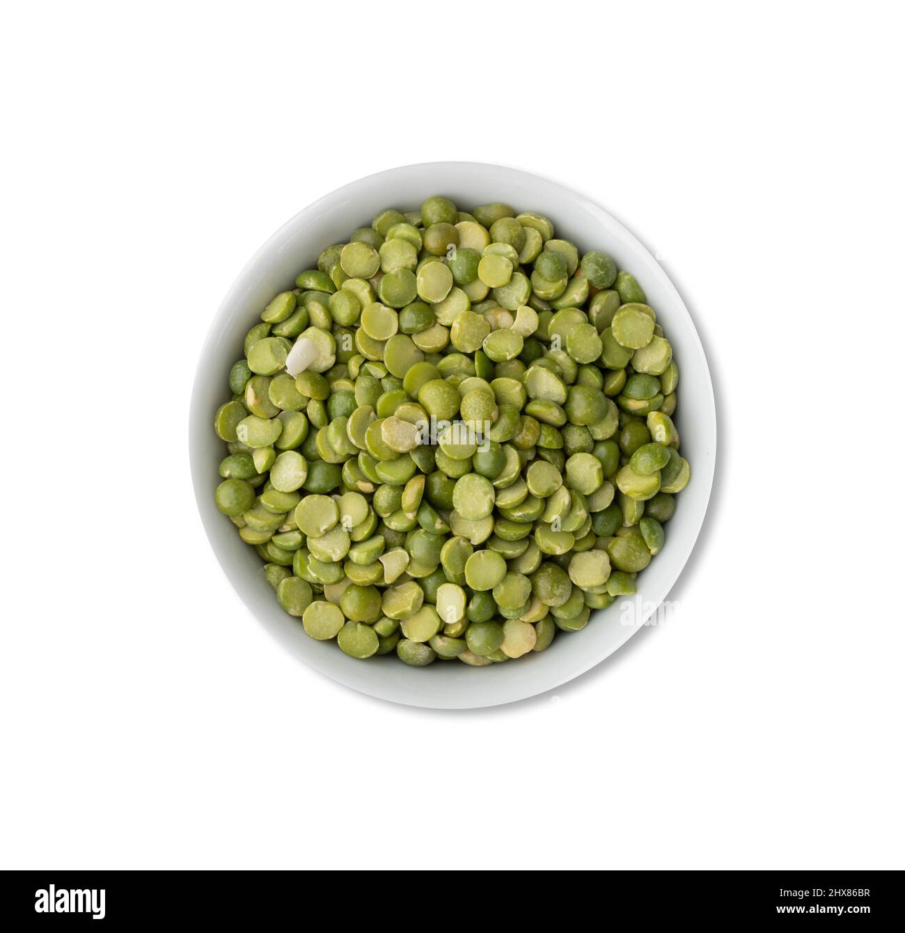 Raw dried green peas in a bowl isolated over white background Stock