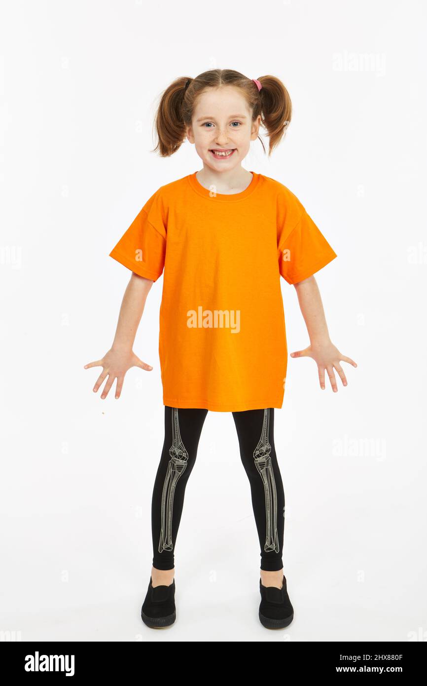 Girl dressed in skeleton leggings and a tshirt Stock Photo