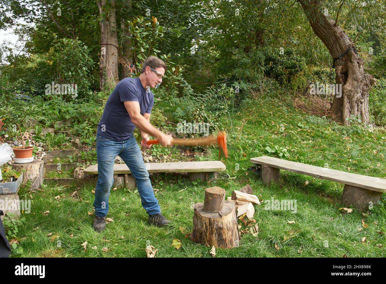 Splitting wood axe step-by-step Stock Photo