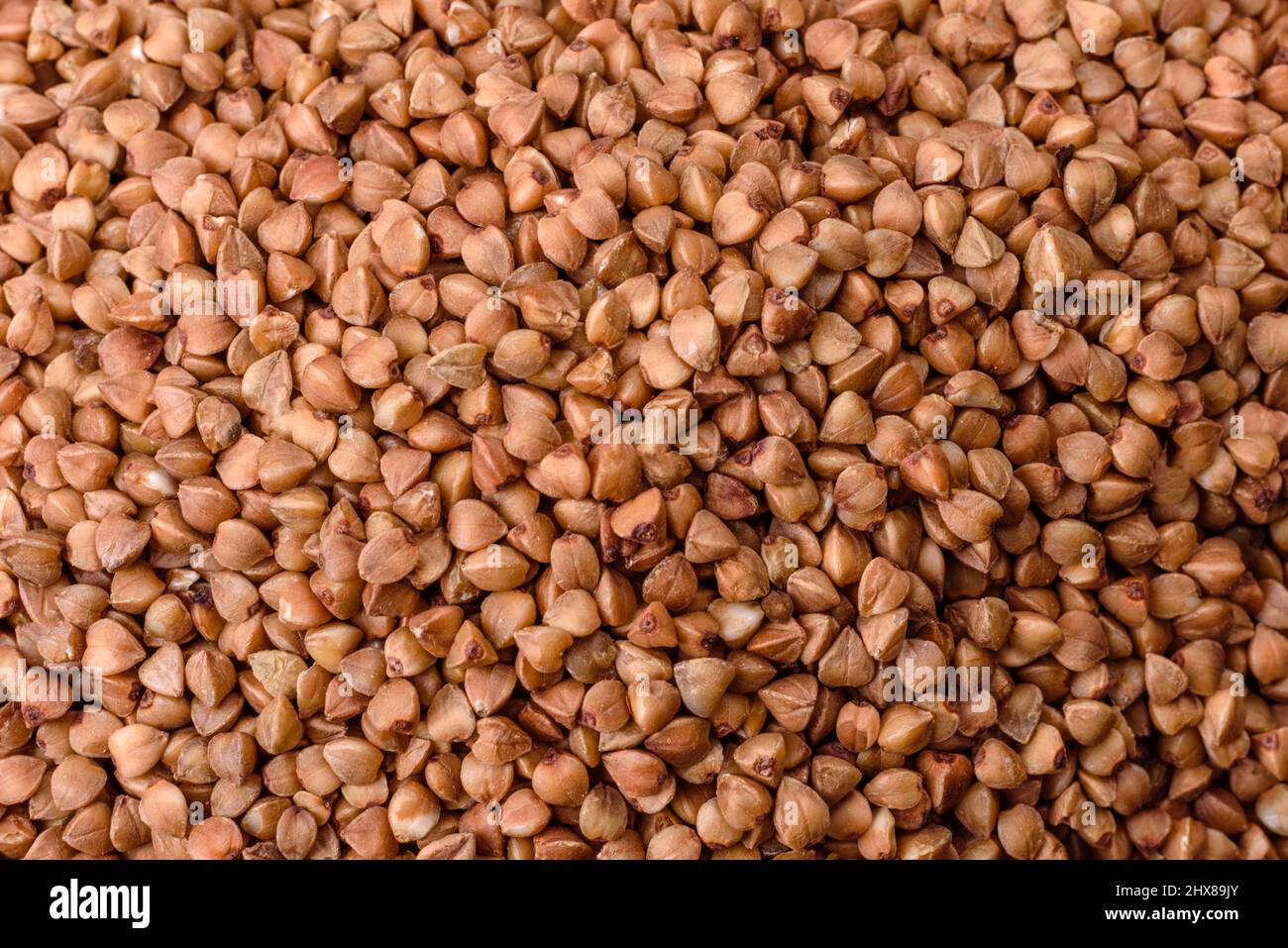 Bio buckwheat cereals raw food background, texture close up. The concept of healthy food
