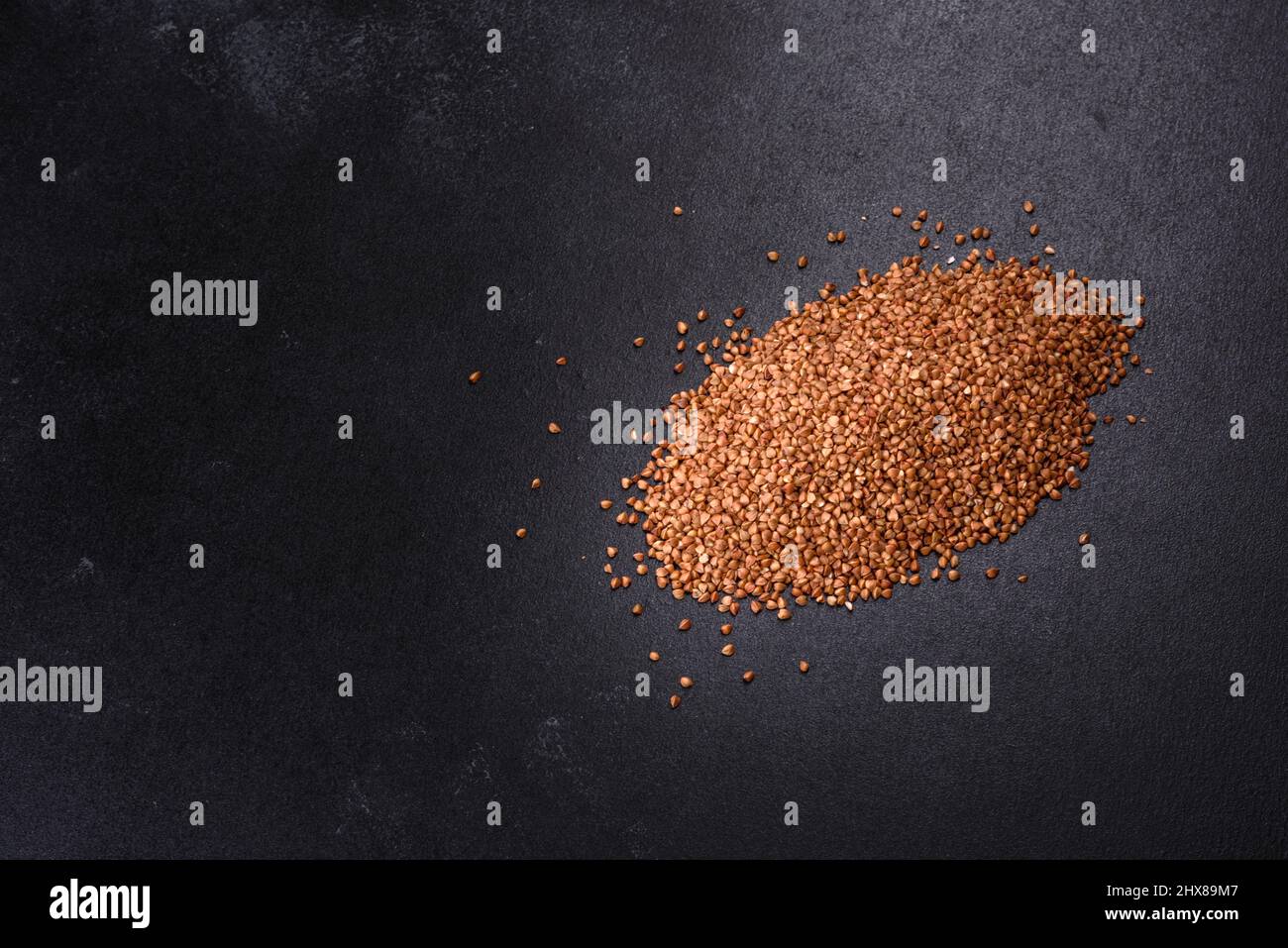 Bio buckwheat cereals raw food background, texture close up. The concept of healthy food