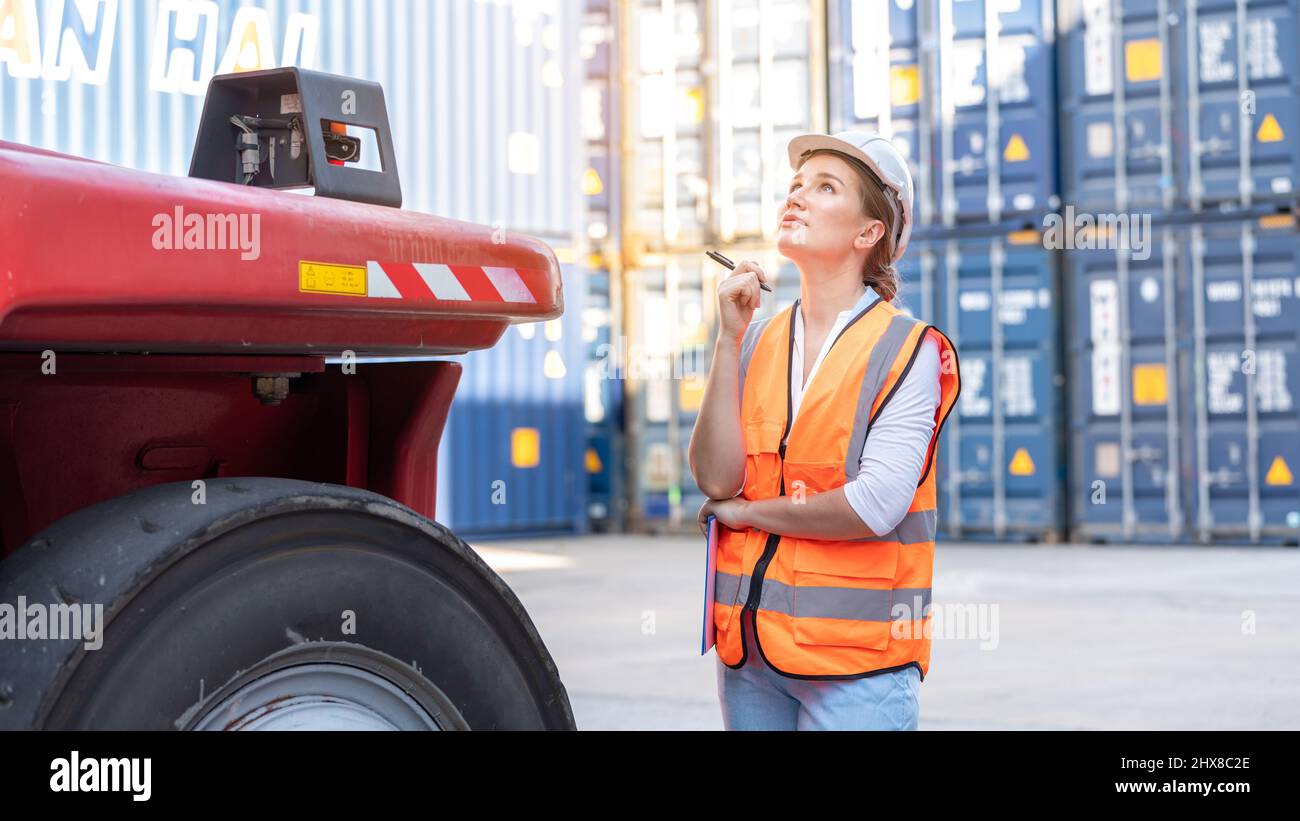 Safety manager checking wheel of cargo container forklift, Foreman pre ...