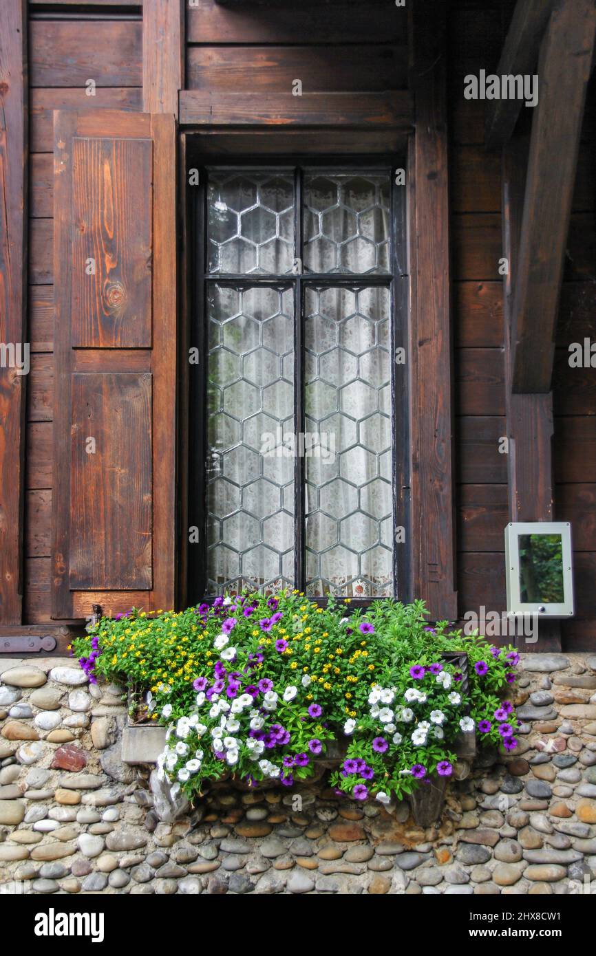 Wood window with flowers Stock Photo - Alamy