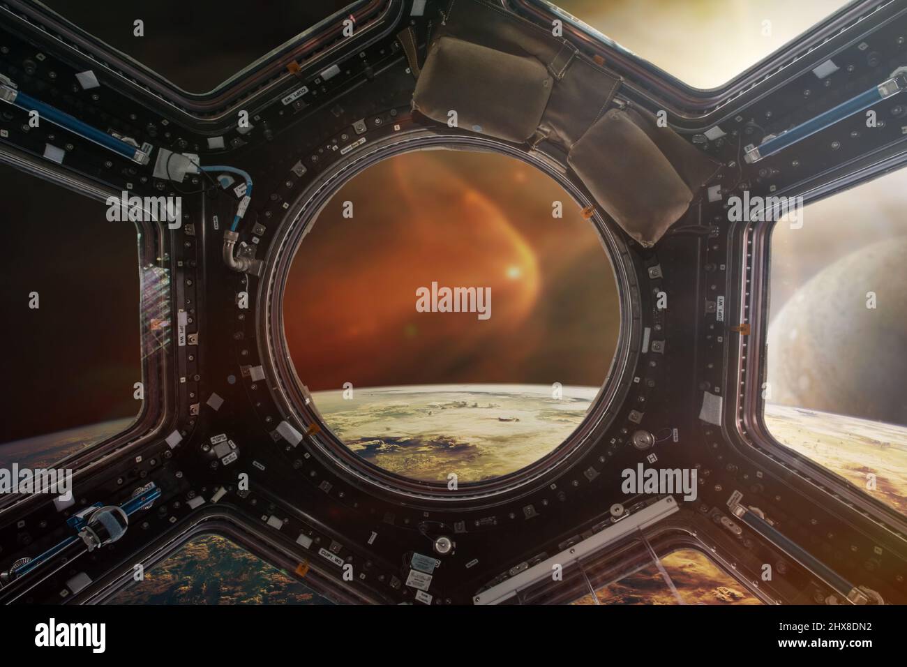 Perfect view from a porthole of spacecraft  on the Earth planet.  Elements of this image furnished by NASA. Stock Photo