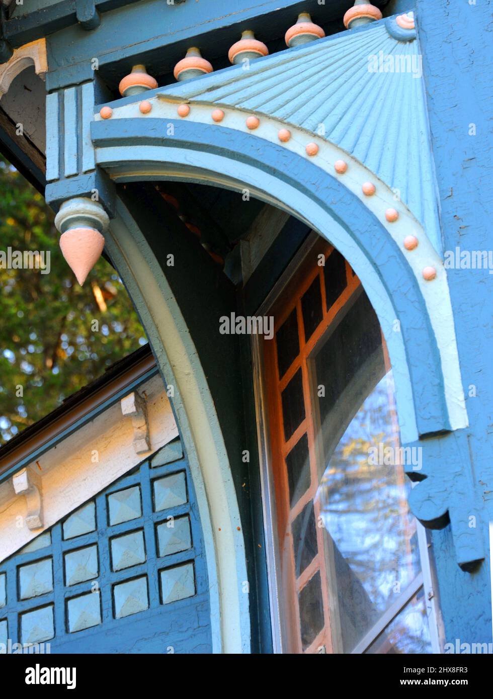 Beautiful wooden trim on Victorian home has spindles and elaborate cuts