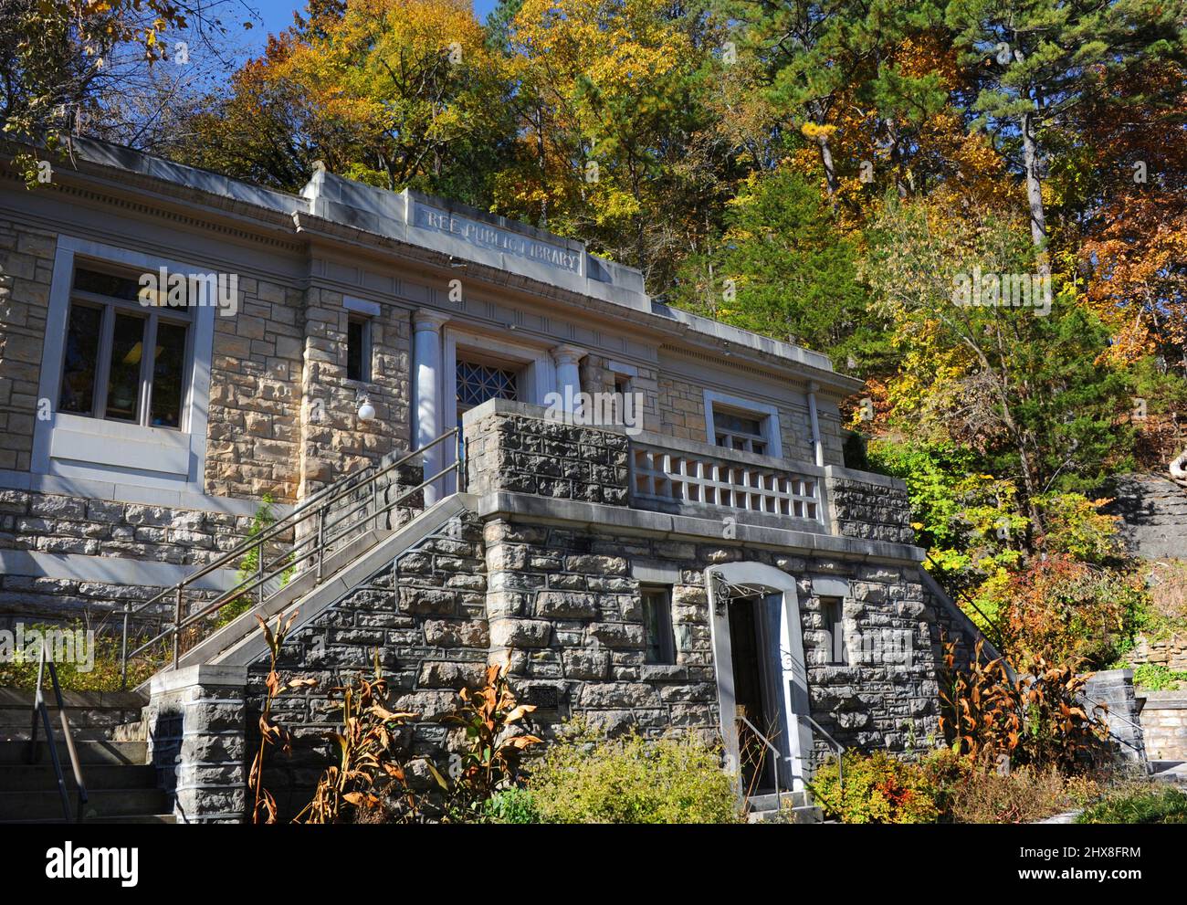 Beautiful and historic Carnegie Public Library is surrounded by Fall foliage and a mountain
