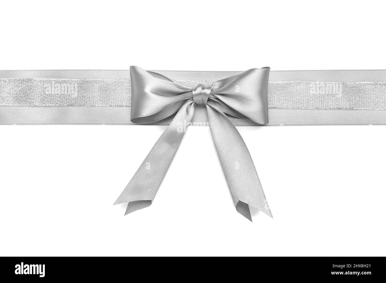 Beautiful silver bow with ribbon on white background Stock Photo - Alamy
