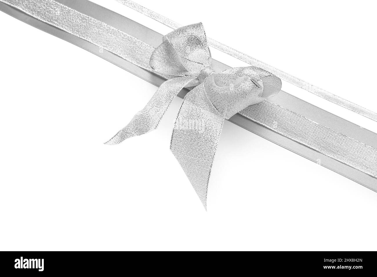 Beautiful silver bow with ribbons on white background Stock Photo - Alamy