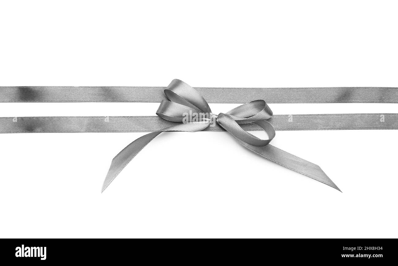 Beautiful silver bow with ribbons on white background Stock Photo - Alamy