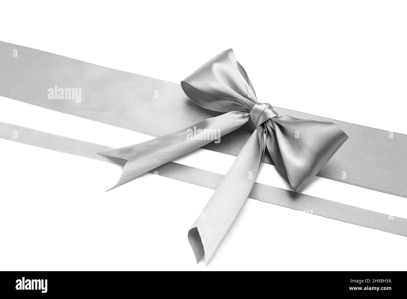 Beautiful silver bow with ribbons on white background Stock Photo - Alamy
