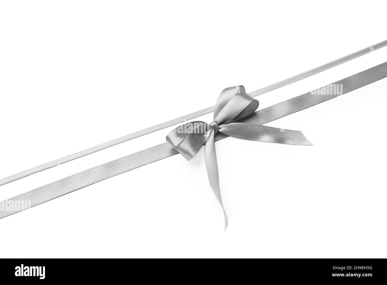 Beautiful silver bow with ribbons on white background Stock Photo - Alamy