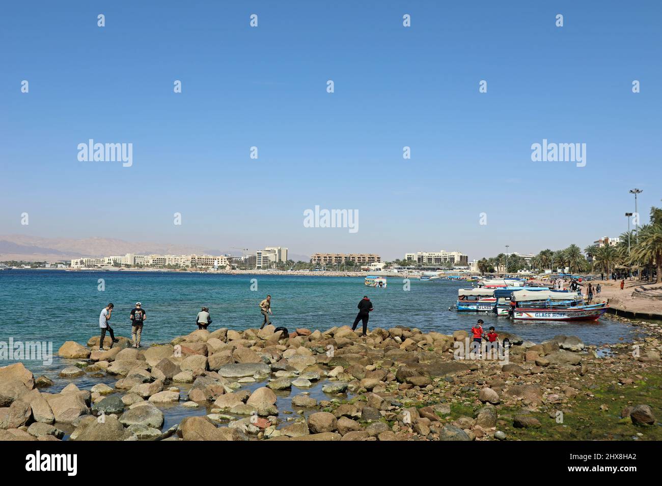 Beachcomers at Aqaba in Jordan Stock Photo