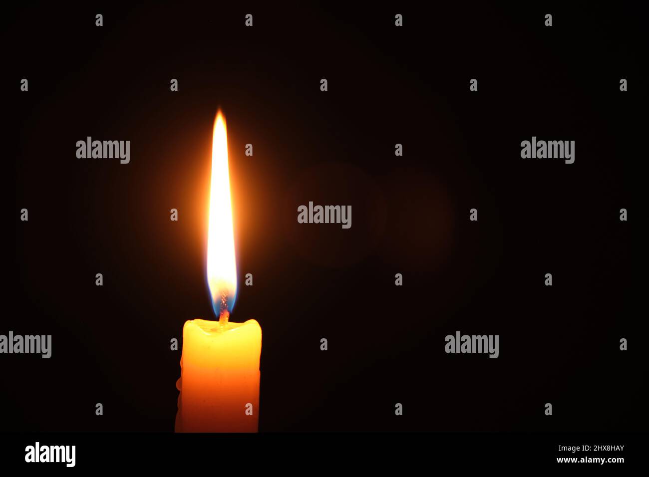 Flame burning candle black background.Concept memory and sorrow Stock