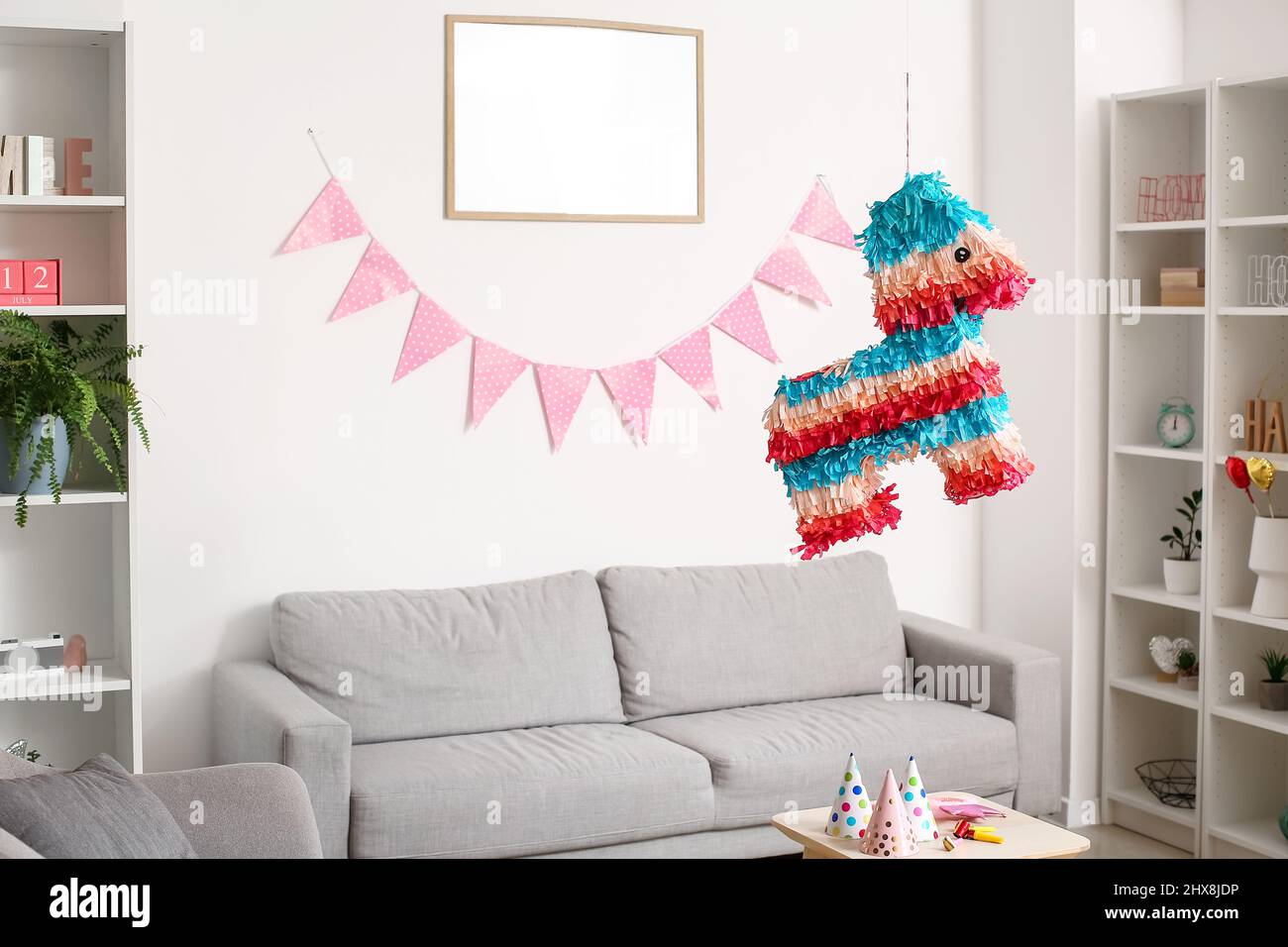 Mexican pinata hanging in living room decorated for Birthday party Stock  Photo - Alamy
