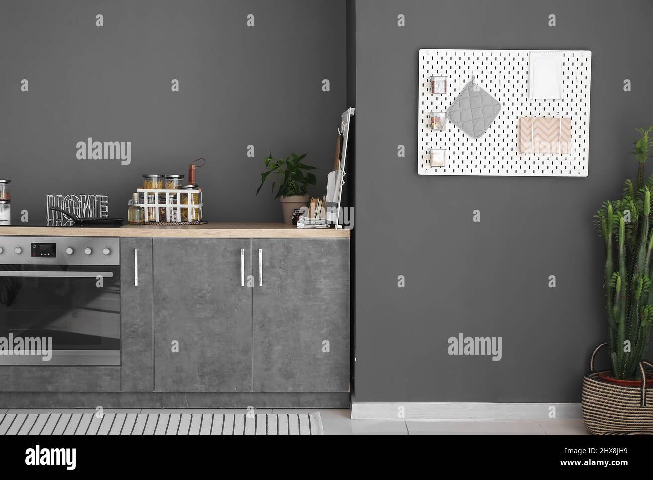 Interior of contemporary kitchen with modern furniture and pegboard ...