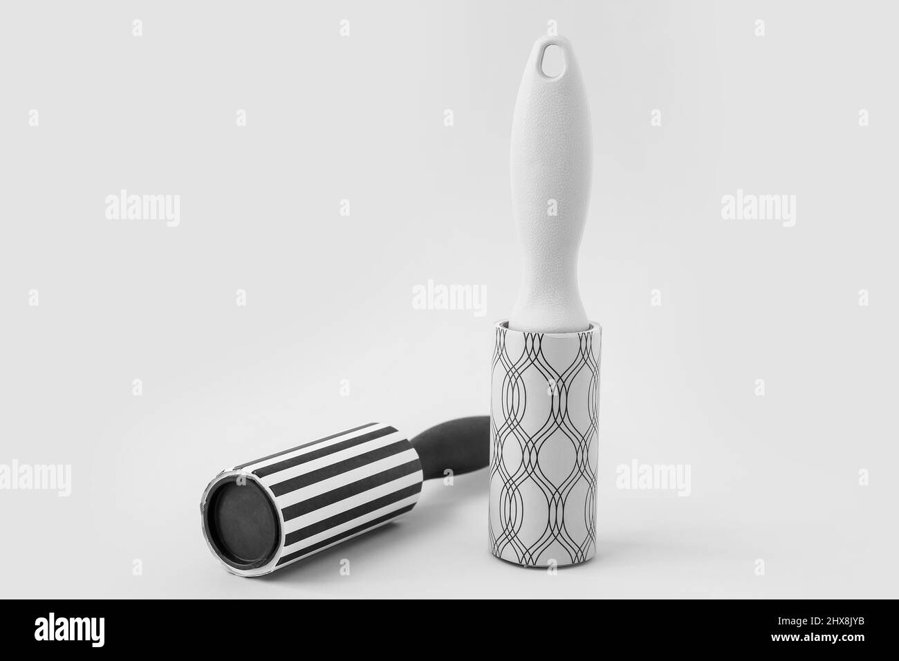 New lint rollers on light background Stock Photo