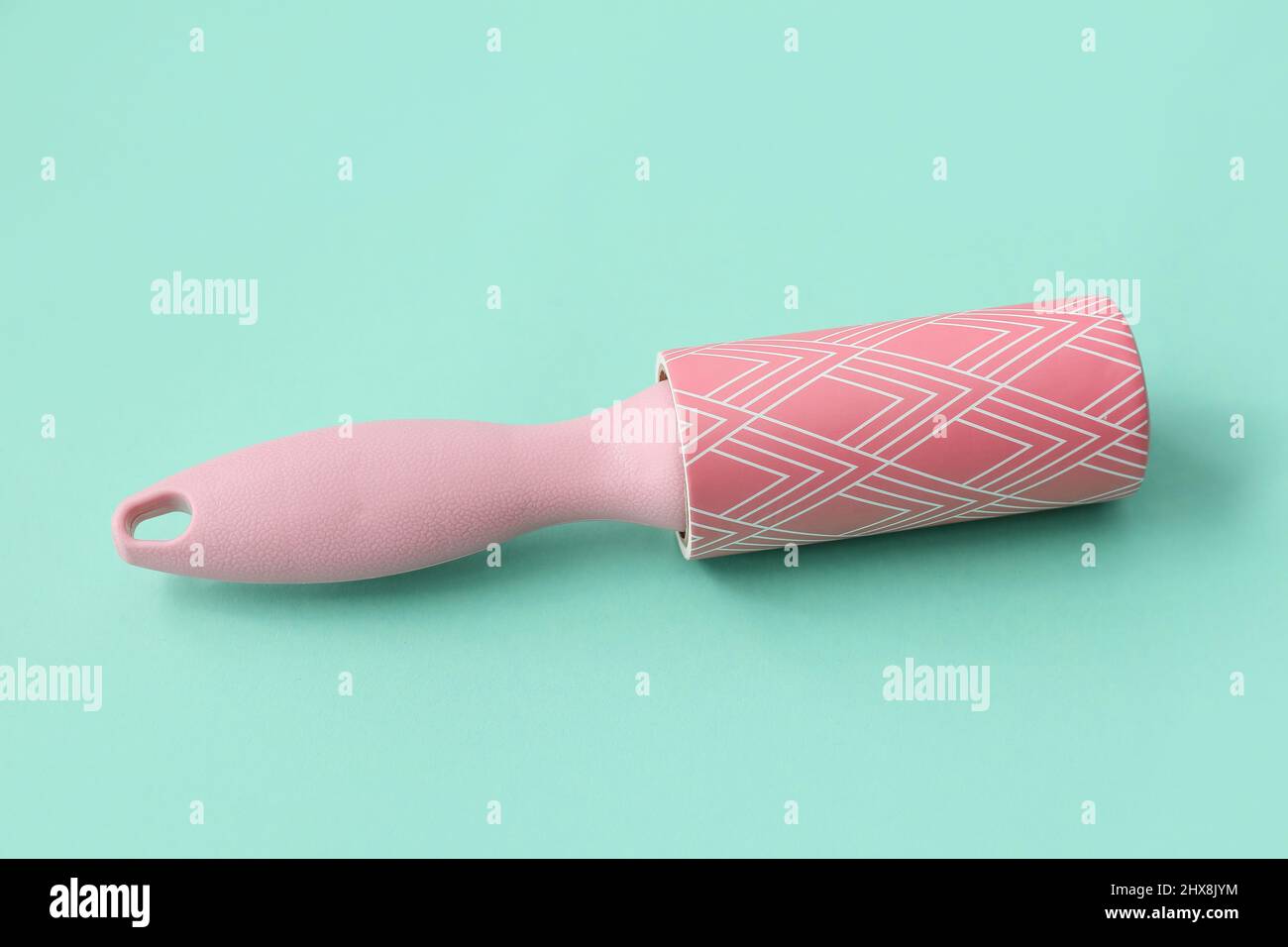 New lint roller on color background Stock Photo