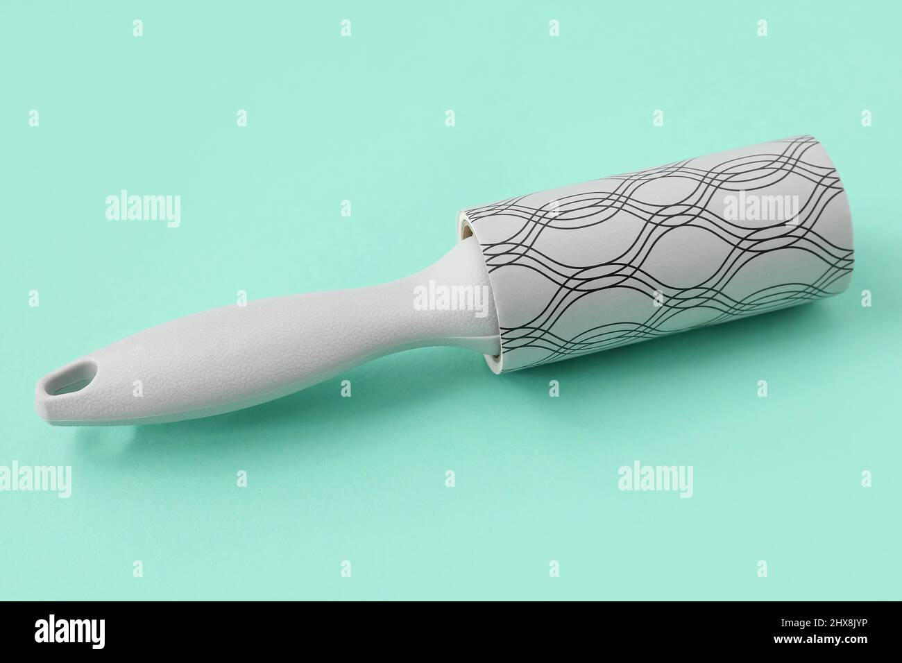 New lint roller on color background Stock Photo