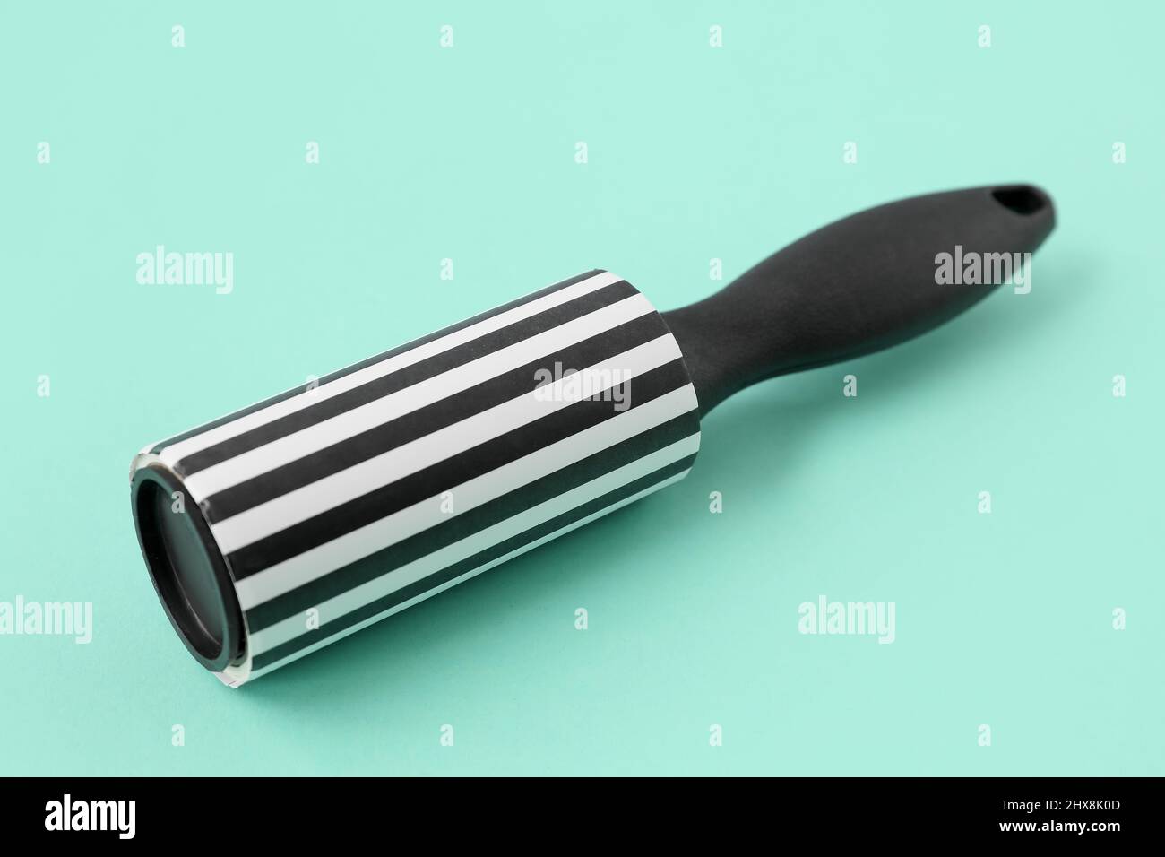 New lint roller on color background Stock Photo