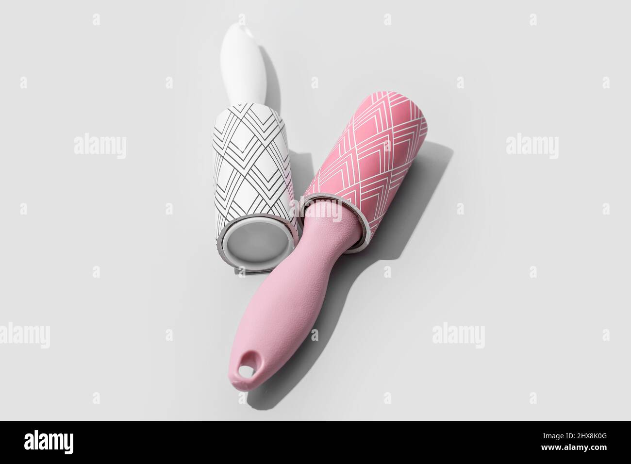 New lint rollers on light background Stock Photo