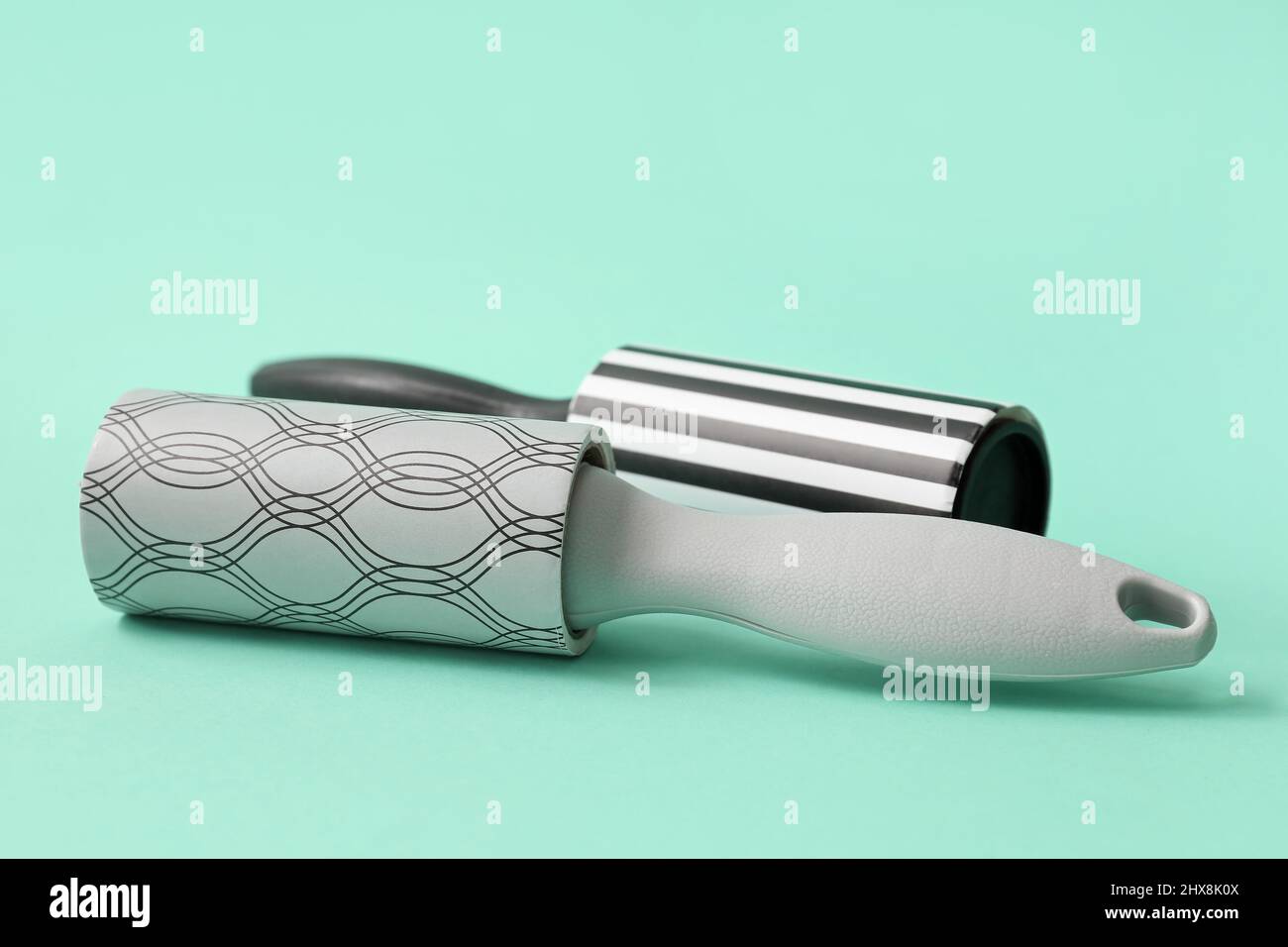 New lint rollers on color background Stock Photo