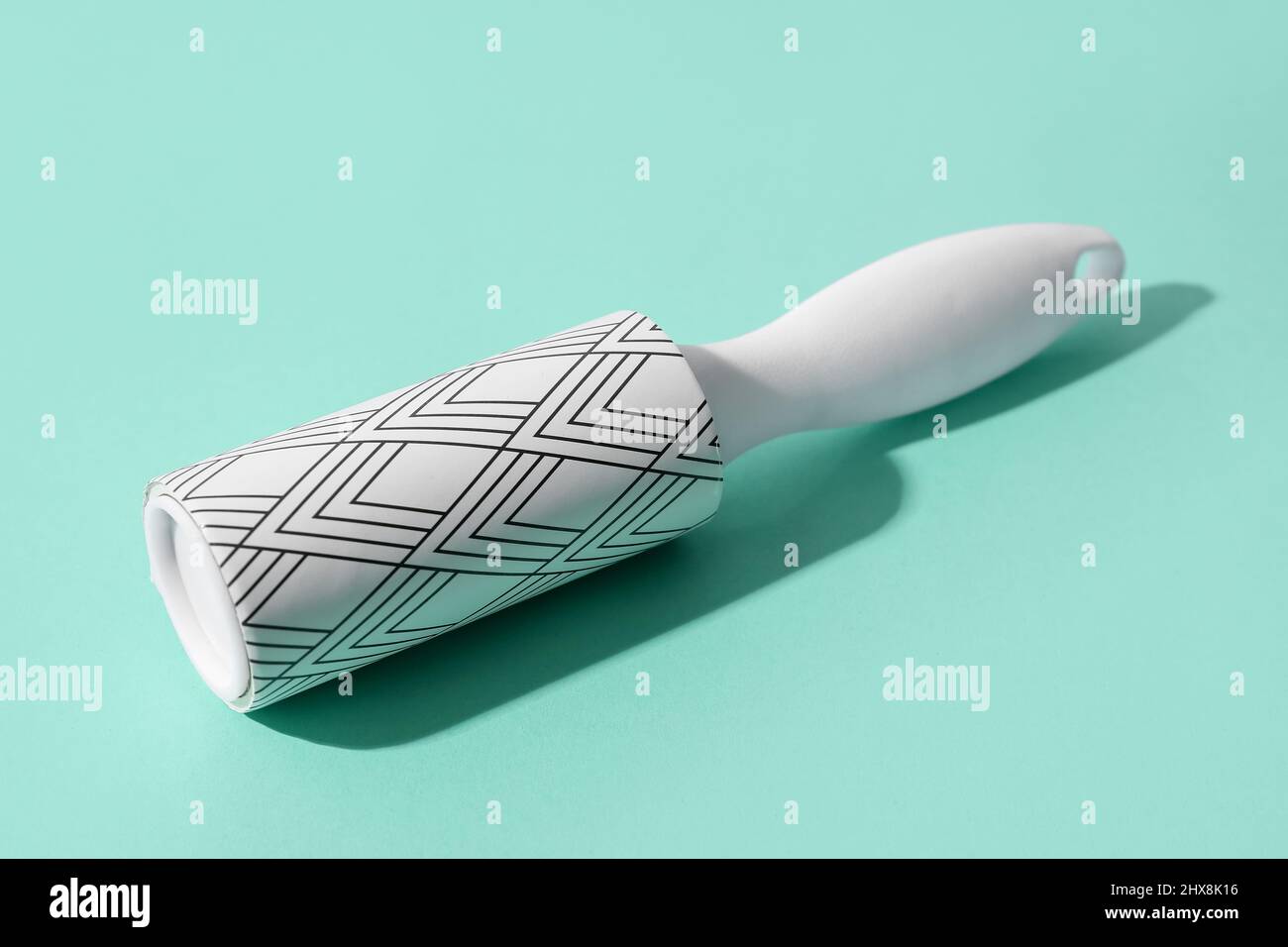 New lint roller on color background Stock Photo