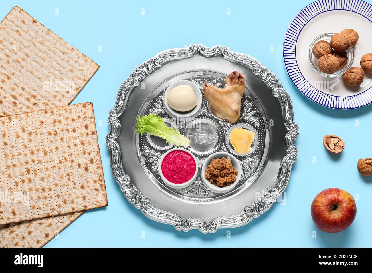 Passover Seder plate with traditional food on color background, top ...