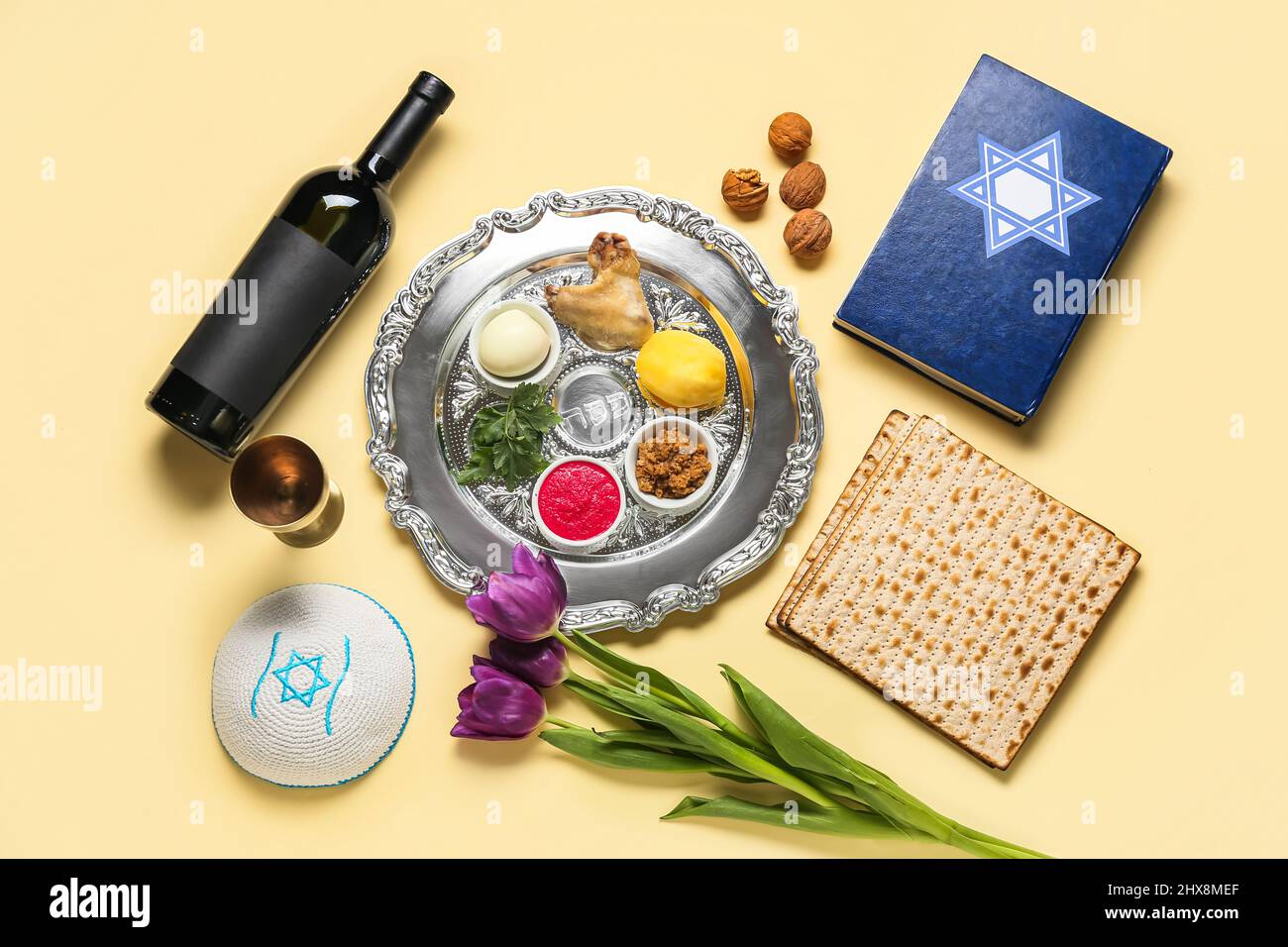 Passover Seder plate with traditional food, wine, Torah and kippah on ...