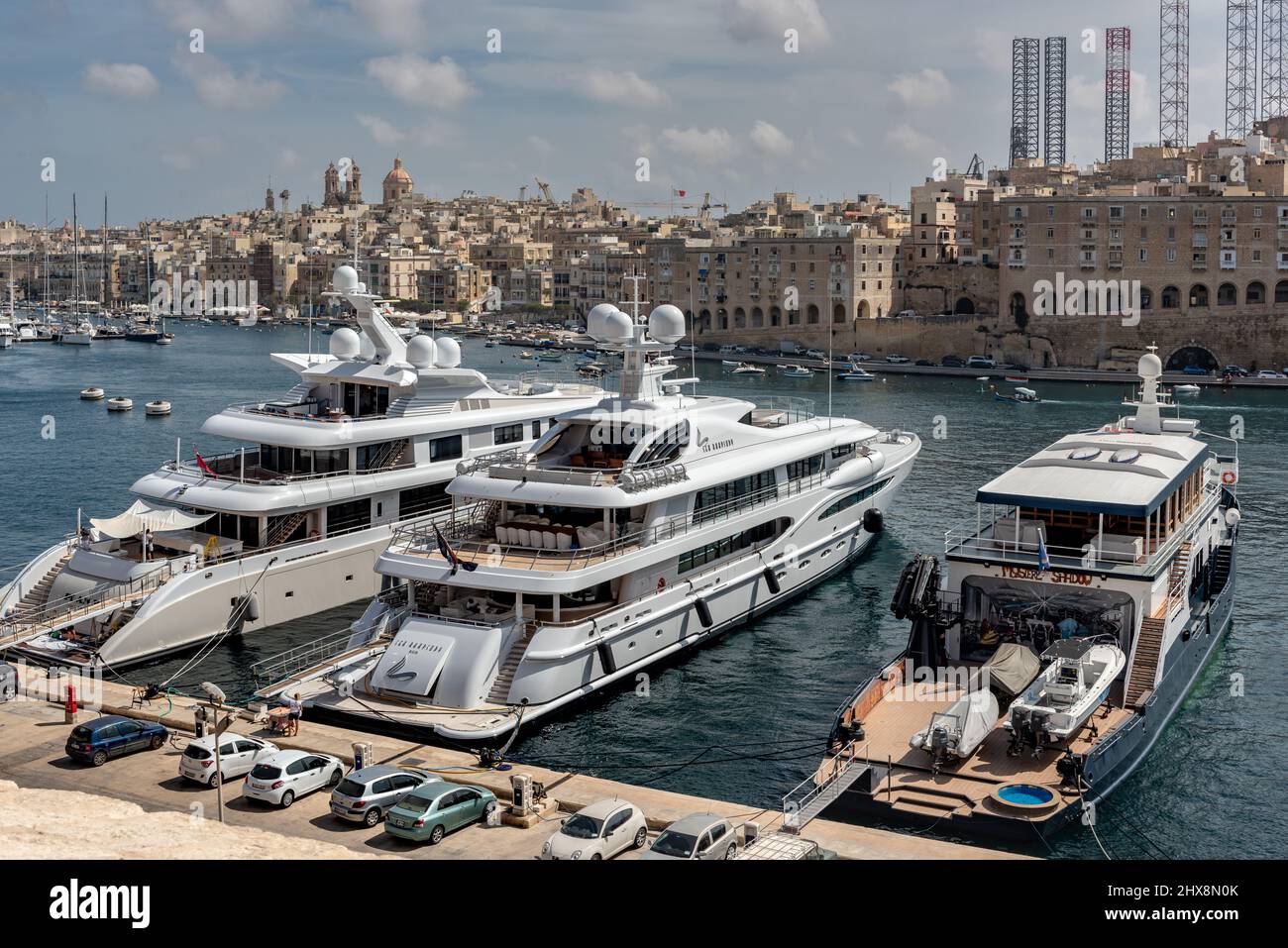 The 212 ft luxury super yacht Sea Rhapsody, and 240 ft Plan B, berthed in Dockyard Creek in Valletta's Grand Harbour. Stock Photo