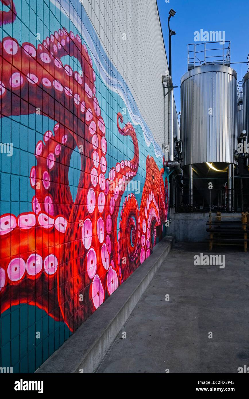 Octopus mural and Beer Brewing tanks, Parallel 49 micro Brewery, East Vancouver, British Columbia, Canada Stock Photo