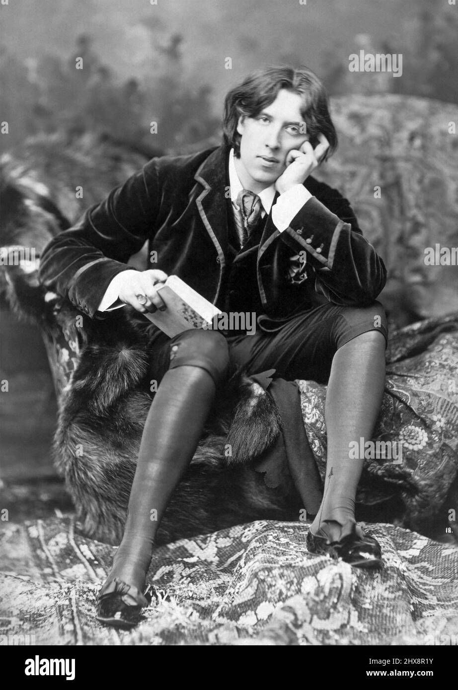 Oscar Wilde (1854-1900) was an Irish author, poet and playwright known for his wit, philosophical aestheticism, and hedonism. Wilde was arrested, tried, and convicted in 1885 for gross indecency with men, and served two years in prison. A few years later he died destitute in Paris at the age of 46. Stock Photo
