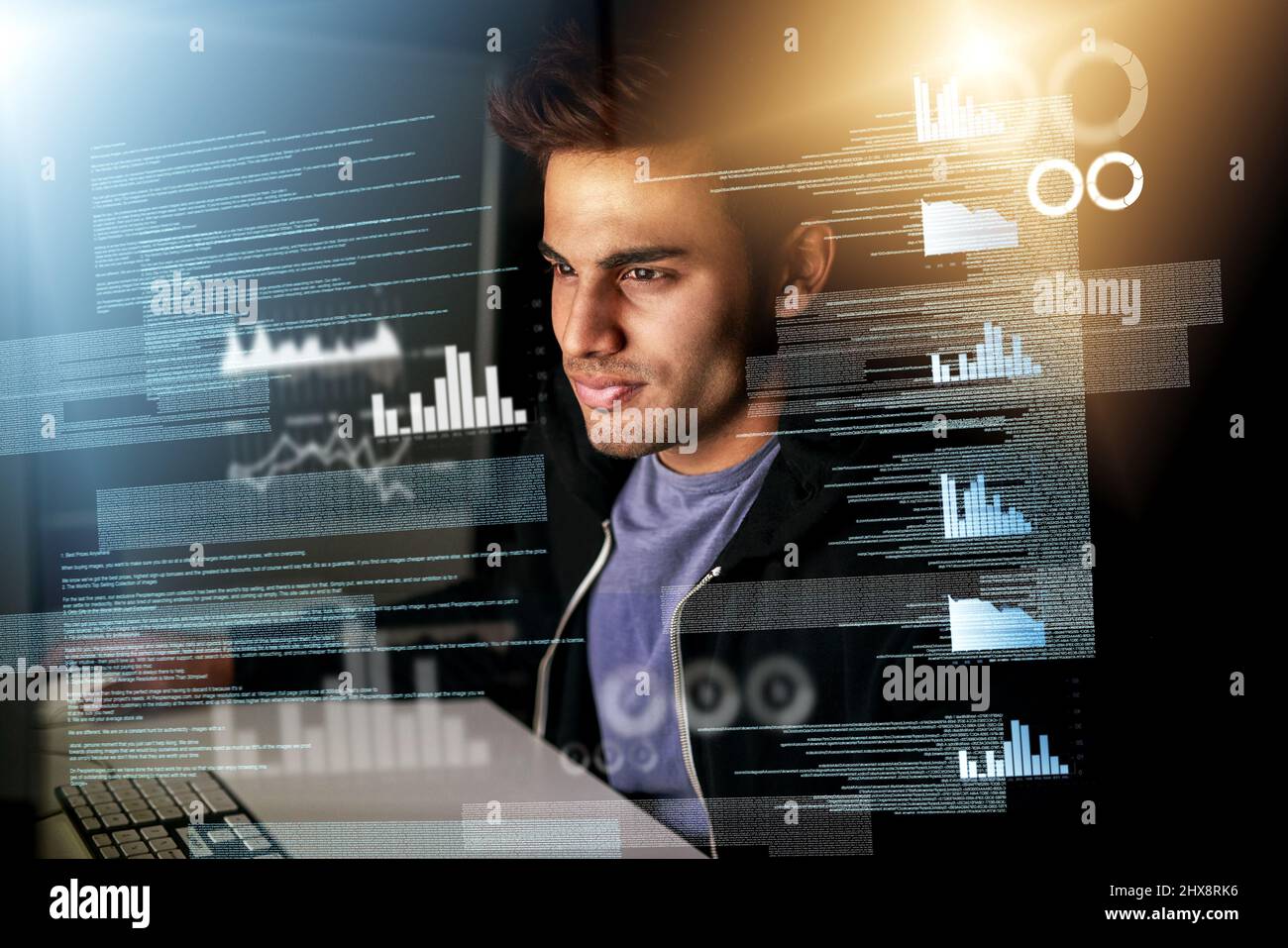 Working on some new code. Cropped shot of a handsome young male computer programmer working on new code. Stock Photo