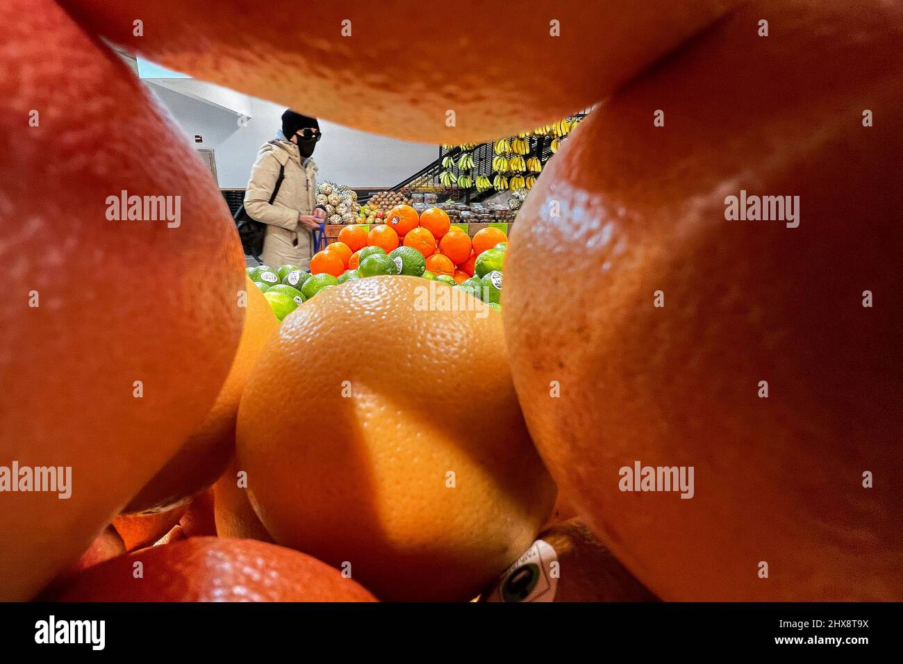 A person shops at a Whole Foods grocery store in the Manhattan borough of New York City, New York, U.S., March 10, 2022.  REUTERS/Carlo Allegri Stock Photo