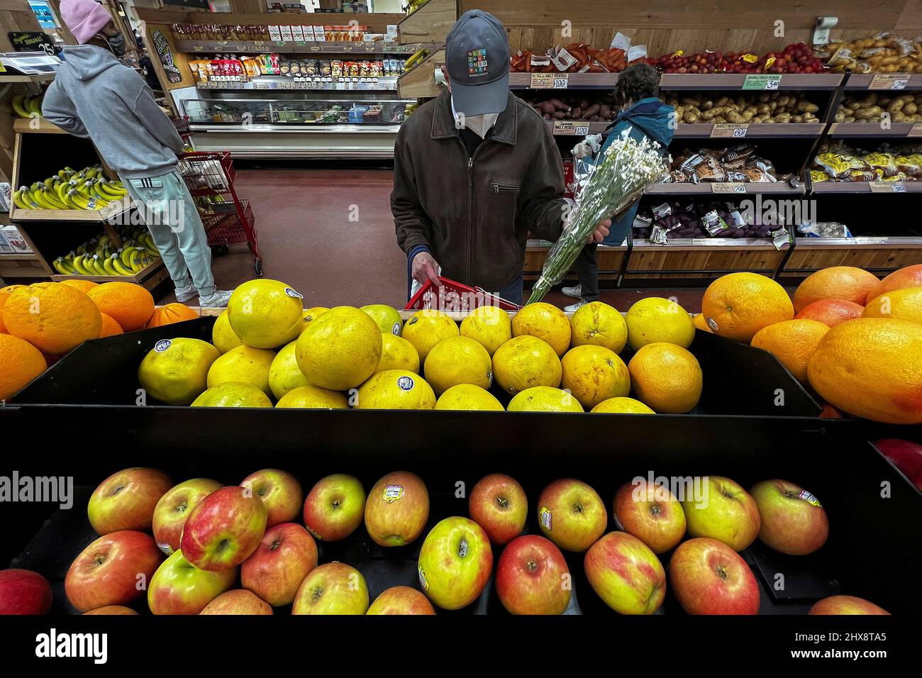A person shops at a Trader Joe's grocery store in the Manhattan borough of New York City, New York, U.S., March 10, 2022.  REUTERS/Carlo Allegri Stock Photo
