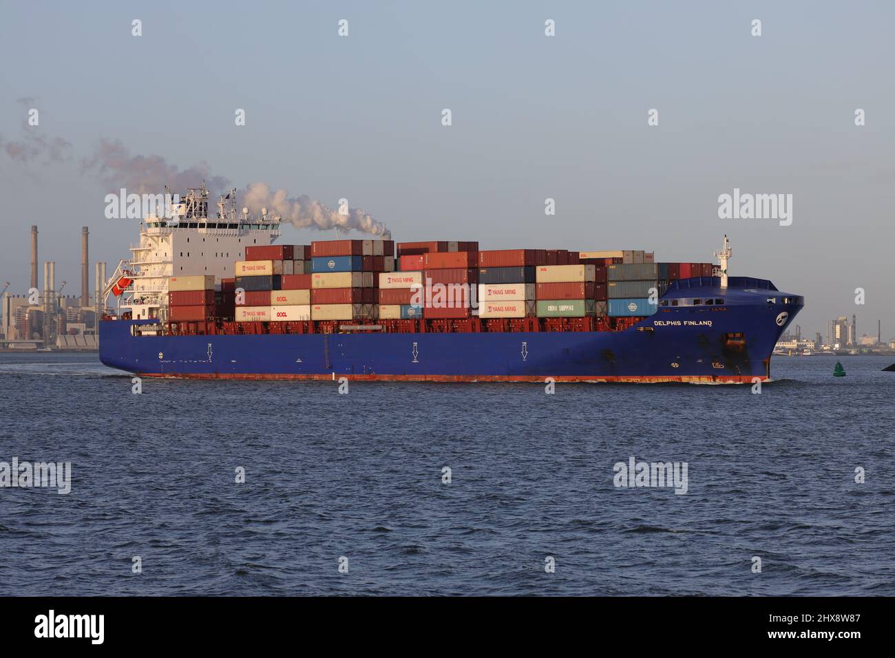 The container ship Delphis Finland leaves the port of Rotterdam on January 30, 2022. Stock Photo