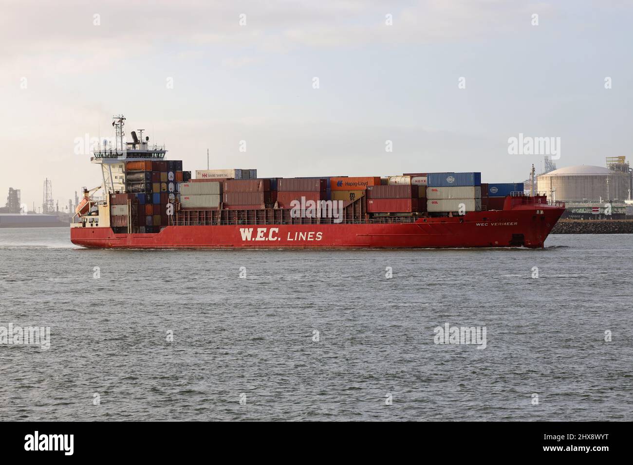 The feeder ship WEC Vermeer leaves the port of Rotterdam on January 30, 2022. Stock Photo