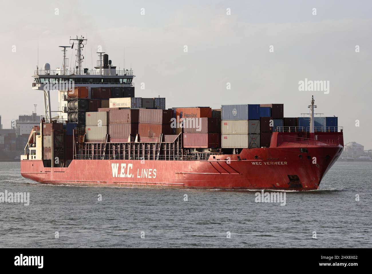 The feeder ship WEC Vermeer leaves the port of Rotterdam on January 30, 2022. Stock Photo