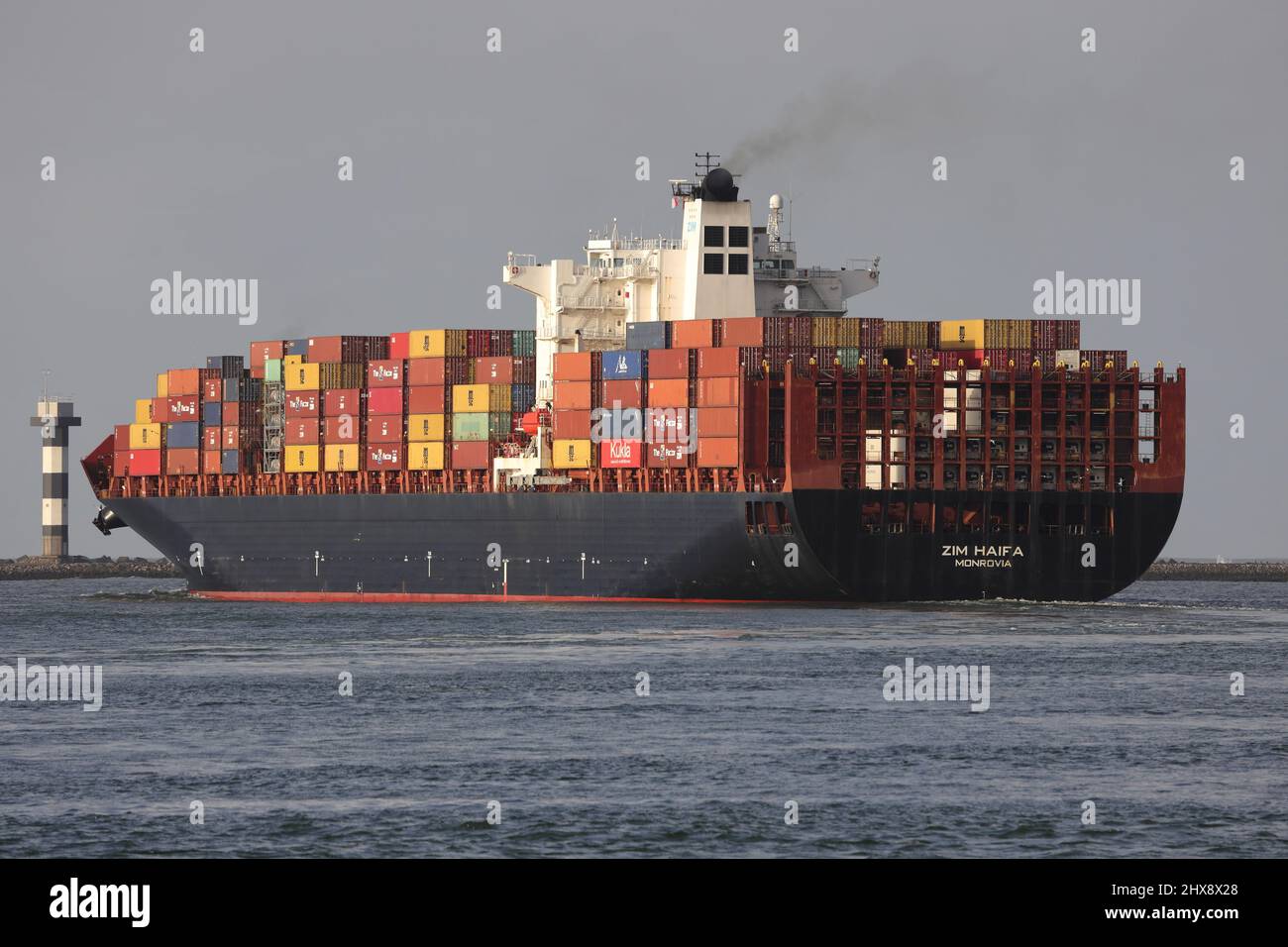 The container ship ZIM Haifa is leaving the port of Rotterdam on January 30, 2022. Stock Photo