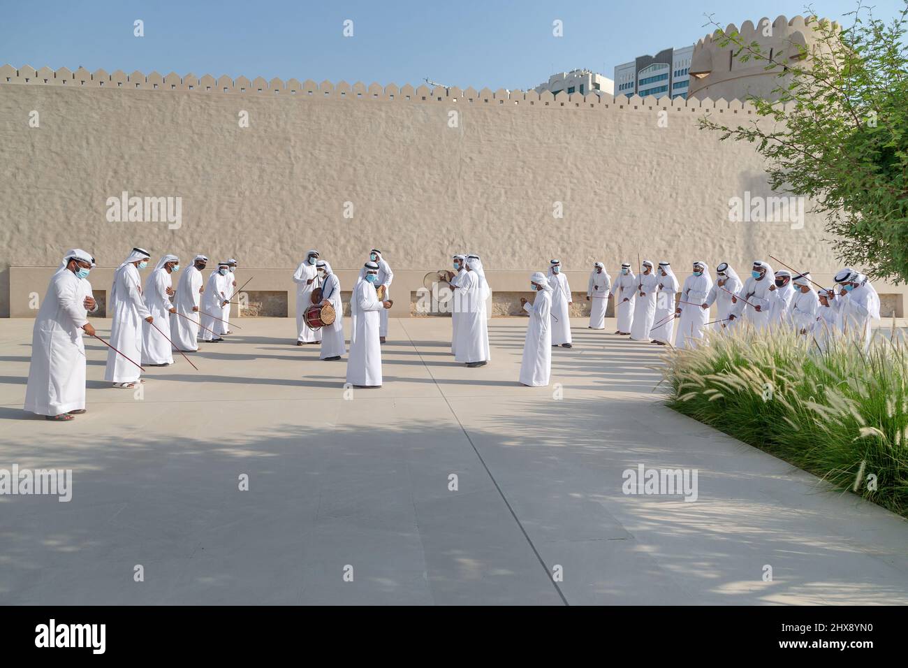 ABU DHABI, UAE - MAY 14, 2021: Traditional Emirati male Al Ayalah dance at Al Hosn Festival Stock Photo