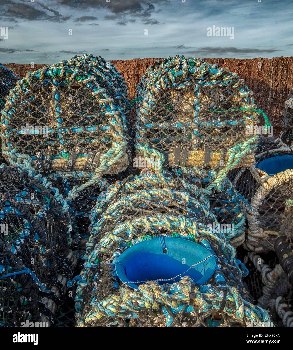 Stacked Crabpots in a wider attractive landscape at Paignton on the