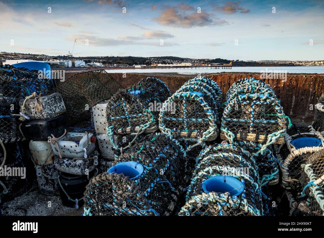 Stacked Crabpots in a wider attractive landscape at Paignton on the