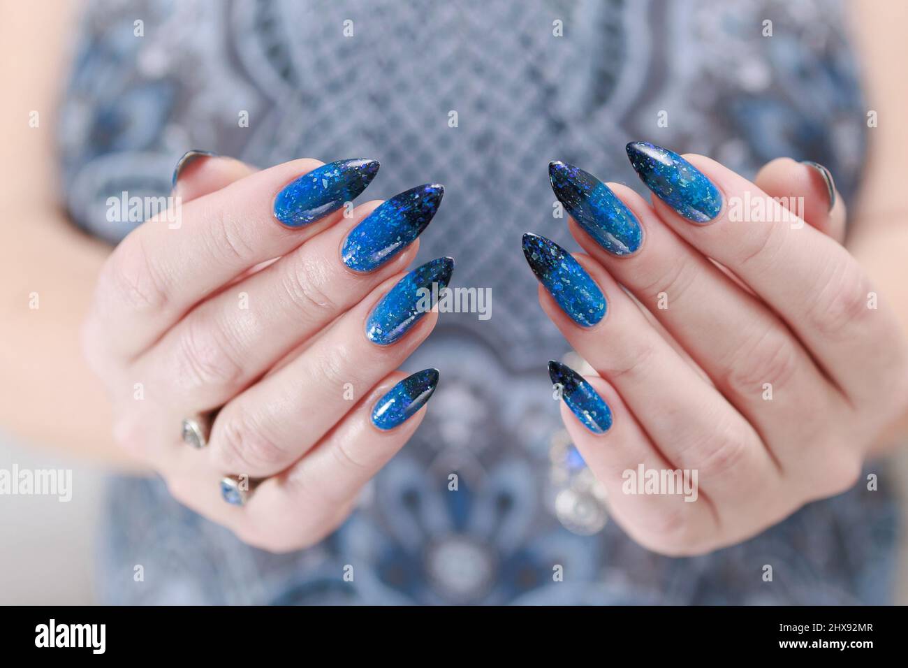 Female hands with long nails with bright blue nail polish Stock Photo - Alamy Female hands with long nails with bright blue nail polish Stock Photo - Alamy