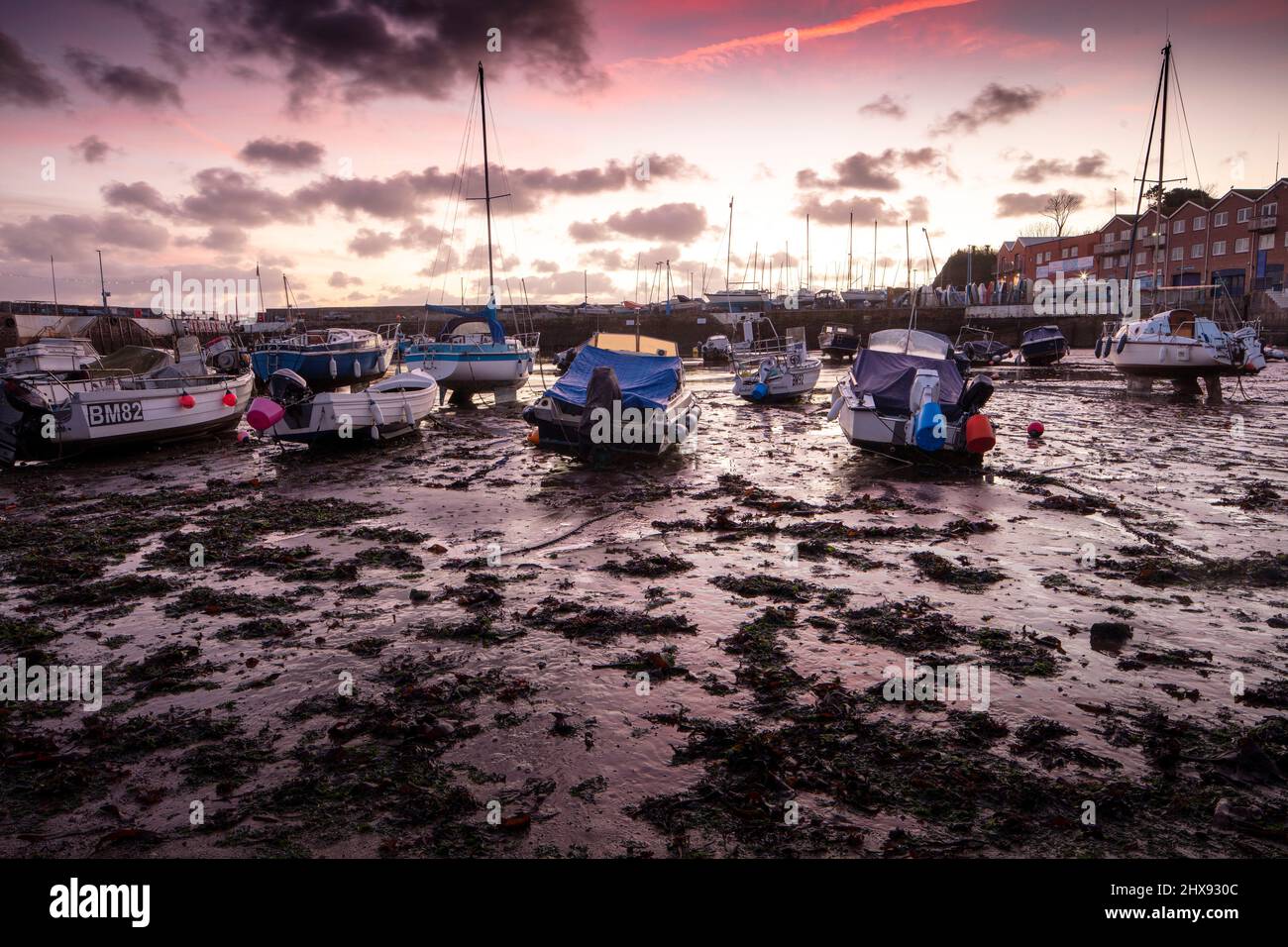 Wholesome dawn scene of the tourist town of Paignton at low tide with