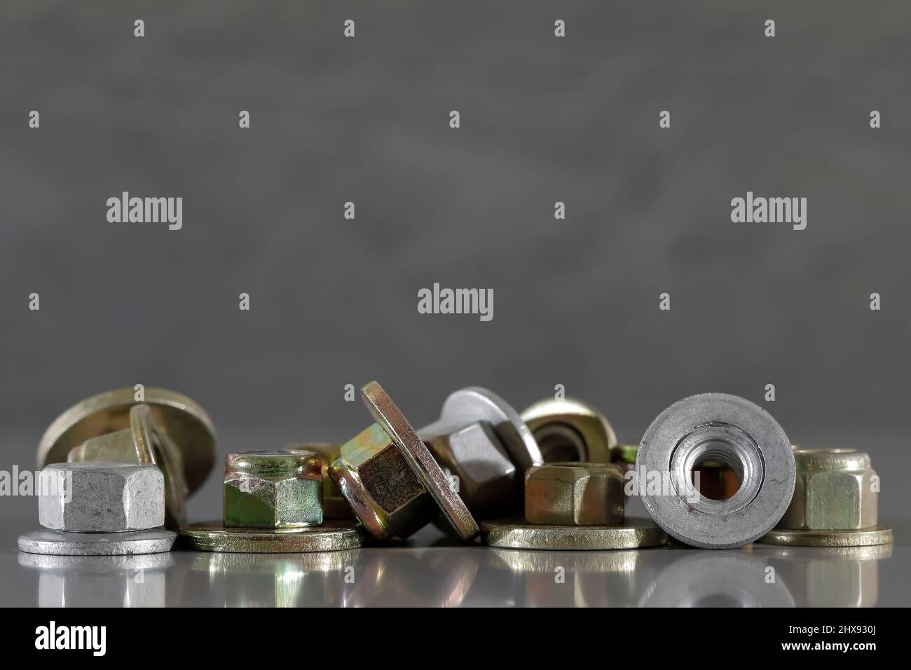 Special screw nuts. Group of small industrial items are automotive parts and have been specially designed to be used for the automotive industry. Stock Photo