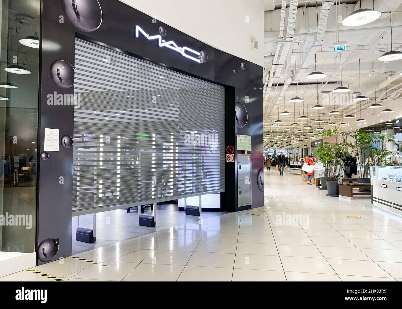 Moscow, Russia, March 2022: M.A.C. Cosmetics store suspends work in Russia. Brand shops in the shopping mall are closed. Customers are passing by. Stock Photo