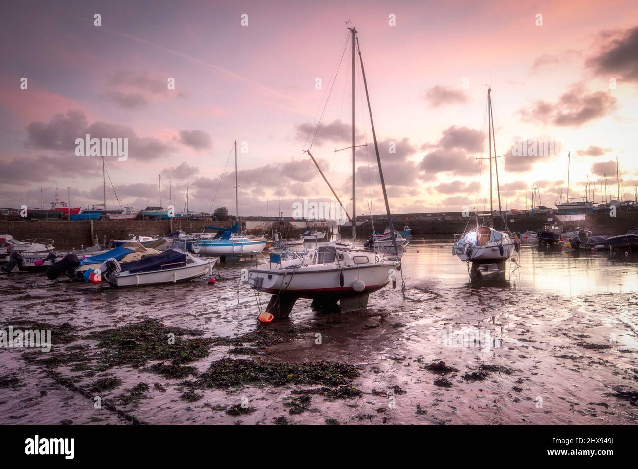 Wholesome dawn scene of the tourist town of Paignton at low tide with