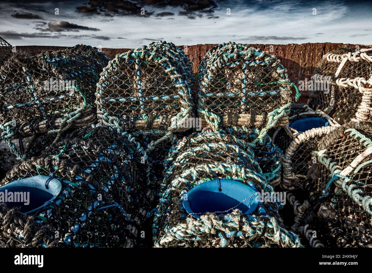 Stacked Crabpots in a wider attractive landscape at Paignton on the